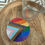 Thumbnail: Bedazzled Pride flag coaster with rainbow colors and sparkling rhinestones, adding vibrant, glittery flair