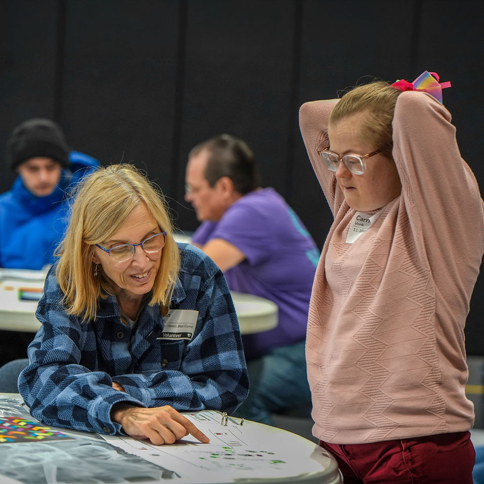 A volunteer helps a special needs girl learn about Jesus during Haven's inclusive Sunday program at Damascus Road Church