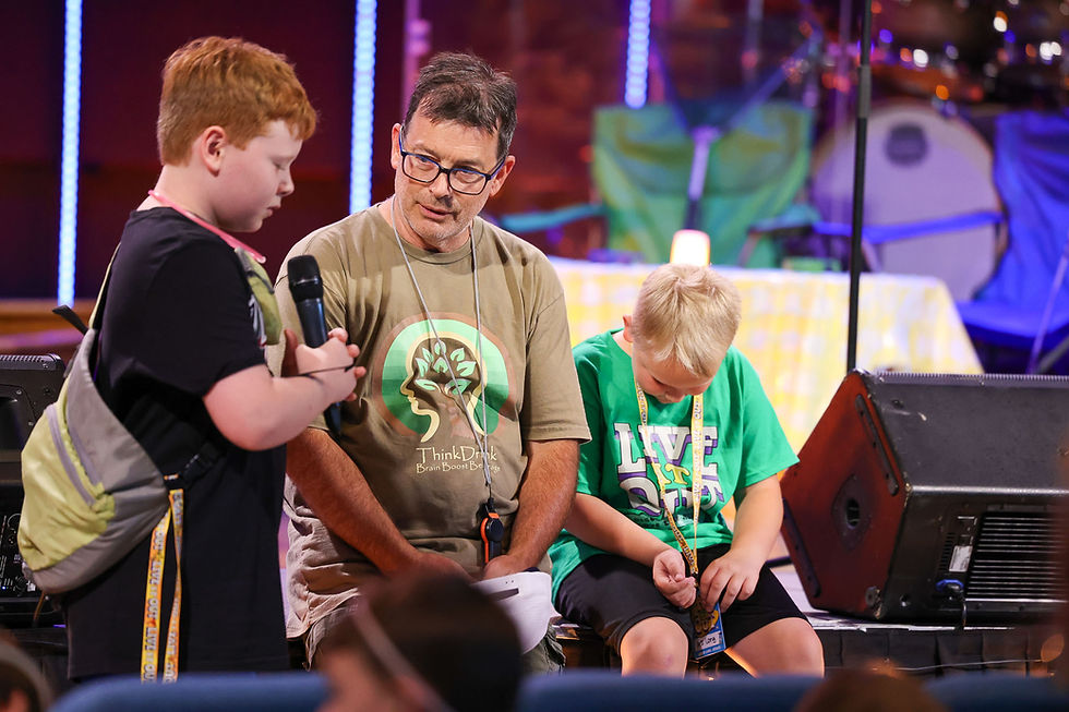 A young boy announcing his faith in Christ at a Damascus Road Kids Summer Camp in Mount Airy