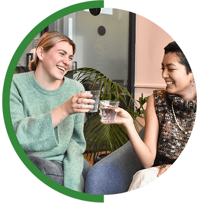 Two ladies drinking water happy