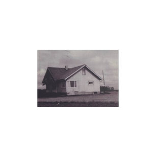 The cover for producer and multi-instrumentalist Kit Gordon's, Kit Gordan -  Taber, 2025 (field recordings) EP, showing and old black-and-white photo of a solitary house on a flat landscape. A vintage car is partially visible beside it under a cloudy sky.