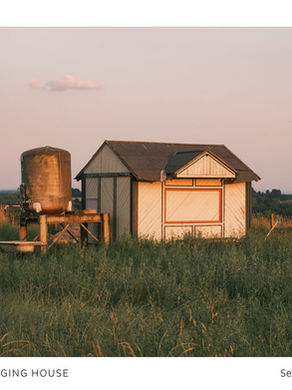 The cover for Jogging House's Sender album, showing a small rural house beside a water tank in tall grass at sunset, with JOGGING HOUSE and Sender text below.