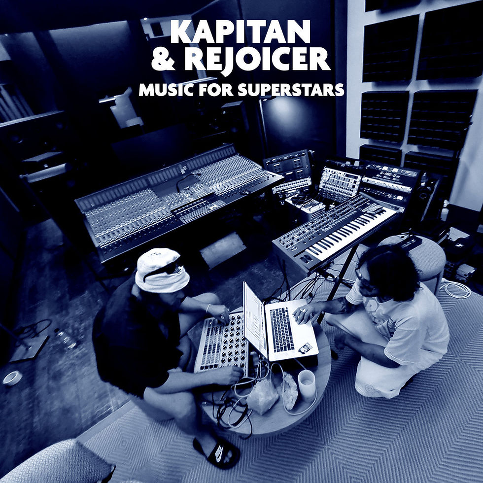 The cover for Israeli music producers Kapitan and Rejoicer's,   Music for Superstars album, showing the them in a music studio work on laptops and equipment. The setting is dimly lit with musical gear. Text reads "Kapitan & Rejoicer Music for Superstars."