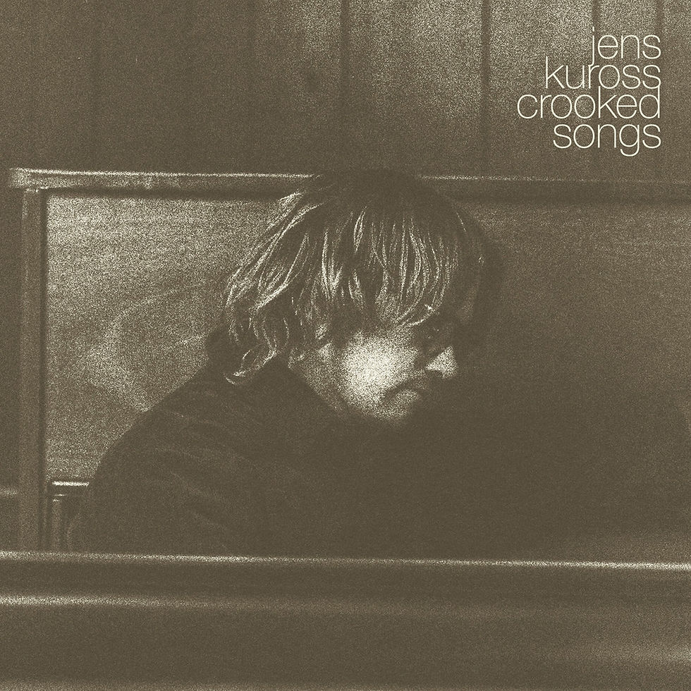 The cover for Jens Kuross', Crooked Songs, showing a grainy image of Jen Kuross with long hair sitting in a dim room, looking down. Text says "jens kuross crooked songs" in the top right corner.