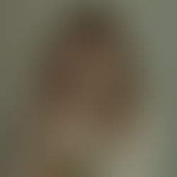The cover for Lucy Kruger & The Lost Boys', Anchor single, showing Lucy Kruger with long hair holding a white rose, eyes closed. Soft lighting and muted colors create a serene, introspective mood.