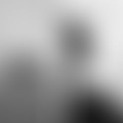 The cover of The Sabbatical Diaries album by Matthew George Luczy, showing a split image of a Luczy's face and an ocean scene with a rock. Text lists music titles and reads "The Sabbatical Diaries." Calm mood.