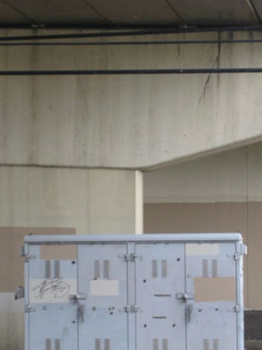 The album cover for Jason Calhoun's revelations of divine love LP, showing a graffiti-marked utility cabinet beneath a stained concrete overpass wall, with beige patches and dim tunnel lighting.