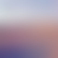 The cover for Cowboy Sadness' Selected Jambient Works Vol. 1, showing a pastel sunset over grassy dunes with a crescent moon; Cowboy Saddles text in the sky, creating a calm, dreamy mood.
