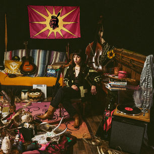 The cover for Mali Obomsawin's Automatic album, showing Obomsawin seated in a cluttered,