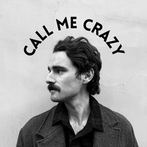 The cover for Gregory Ackerman's "Call Me Crazy" single, showing Ackerman with mustache in profile view against a plain wall, text above reads: Call Me Crazy. Black and white tone, thoughtful expression.