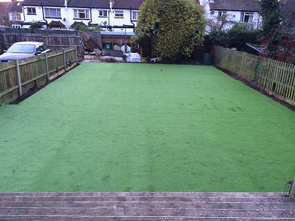 laying artificial turf fake lawn to garden
