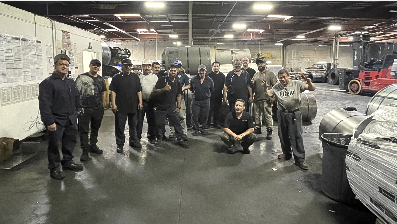 Blue Star Metals team gathered together on the shop floor