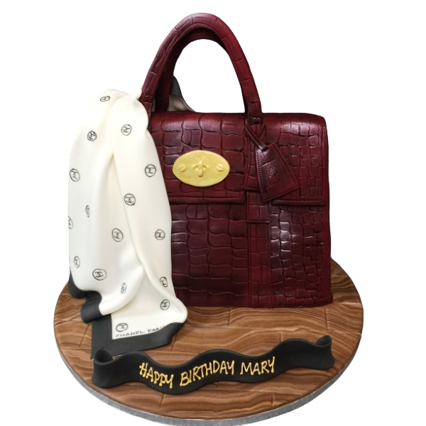 Bespoke 3D Mulberry bag cake with edible scarf detail, crafted in Solihull, West Midlands for celebration.