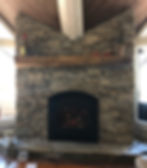 Floor to ceiling natural stone fireplace with flagstone hearth and custom mantle Lake Tahoe