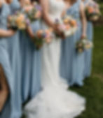 Dusty blue bridesmaids dresses with airy modern pastel coloured bouquets