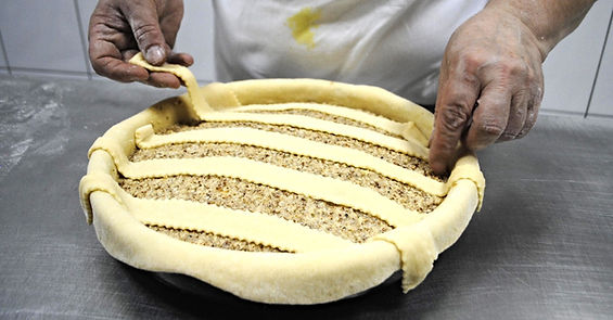Ane laying down the crust for the Imotski Torta Recipe, Imotski, Croatia