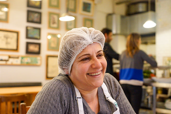 Nada Saber smiling at Tawlet in Beirut, Lebanon