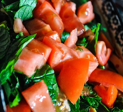 tomatoes over a bed of romaine and mint