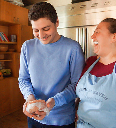 Georgina's son making Kibbeh Erras in Lebanon