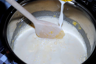 Adding the milk to make the custard for the Italian Zuppa Inglese Recipe