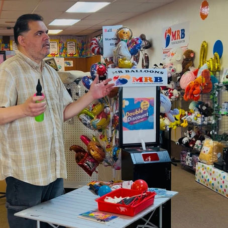 MR Balloons teaching balloon twisting