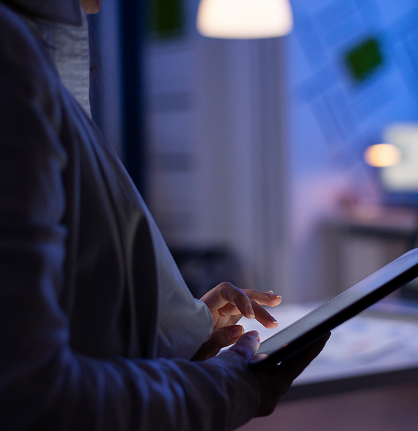 close-up-woman-hands-typing-tablet-checking-financial-graphs-standing-start-up-office-late