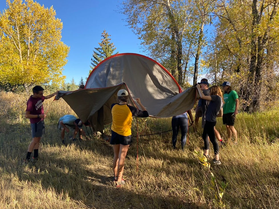 My staff inspecting a tent from when I owned an outdoor retail store.