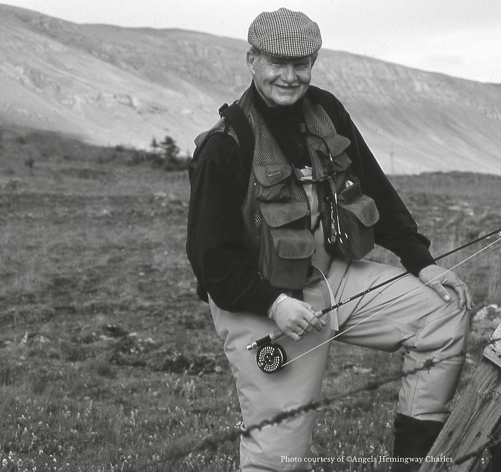 Jack Hemingway: A seasoned angler with a thoughtful smile pauses in a rugged landscape, embodying the spirit of meaningful exchanges; an idea echoed by Thomas Jefferson's words on enriching encounters.