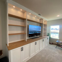 Entertainment center white lighted shelves media room, Raleigh NC