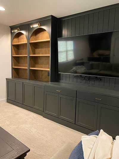 Charcoal entertainment center built-in with arched wood shelves, Raleigh NC