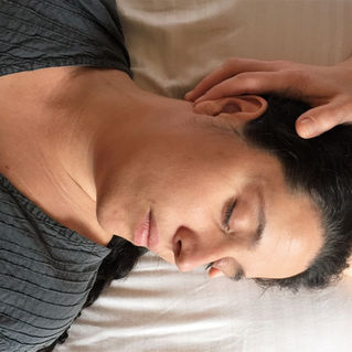 Relaxing craniosacral hold for relieving pain and tension.
