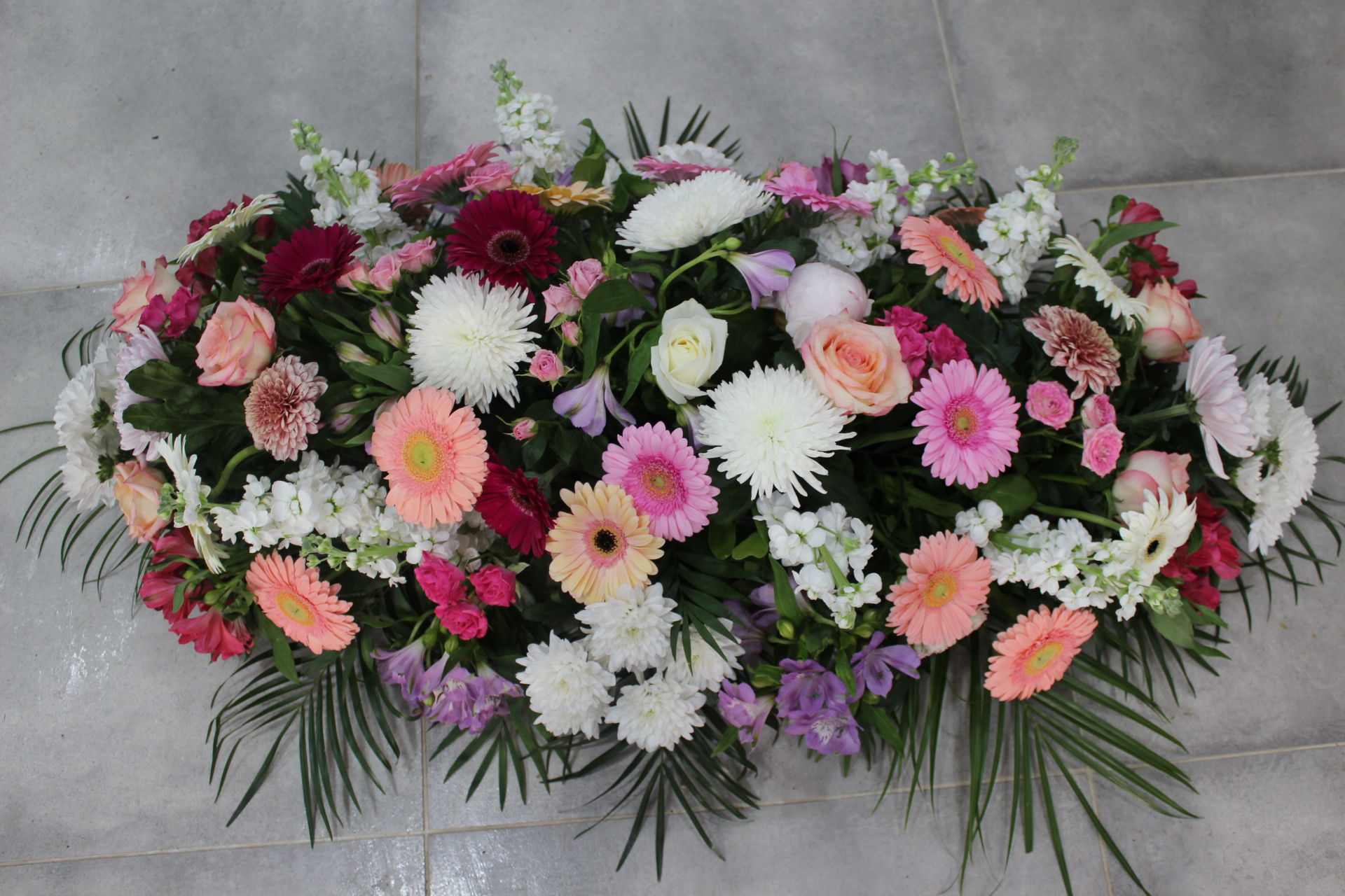 Coussin long teintes pastelles