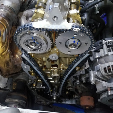 Experienced technician replacing a timing chain during engine repair at FLEETDOC Peterborough