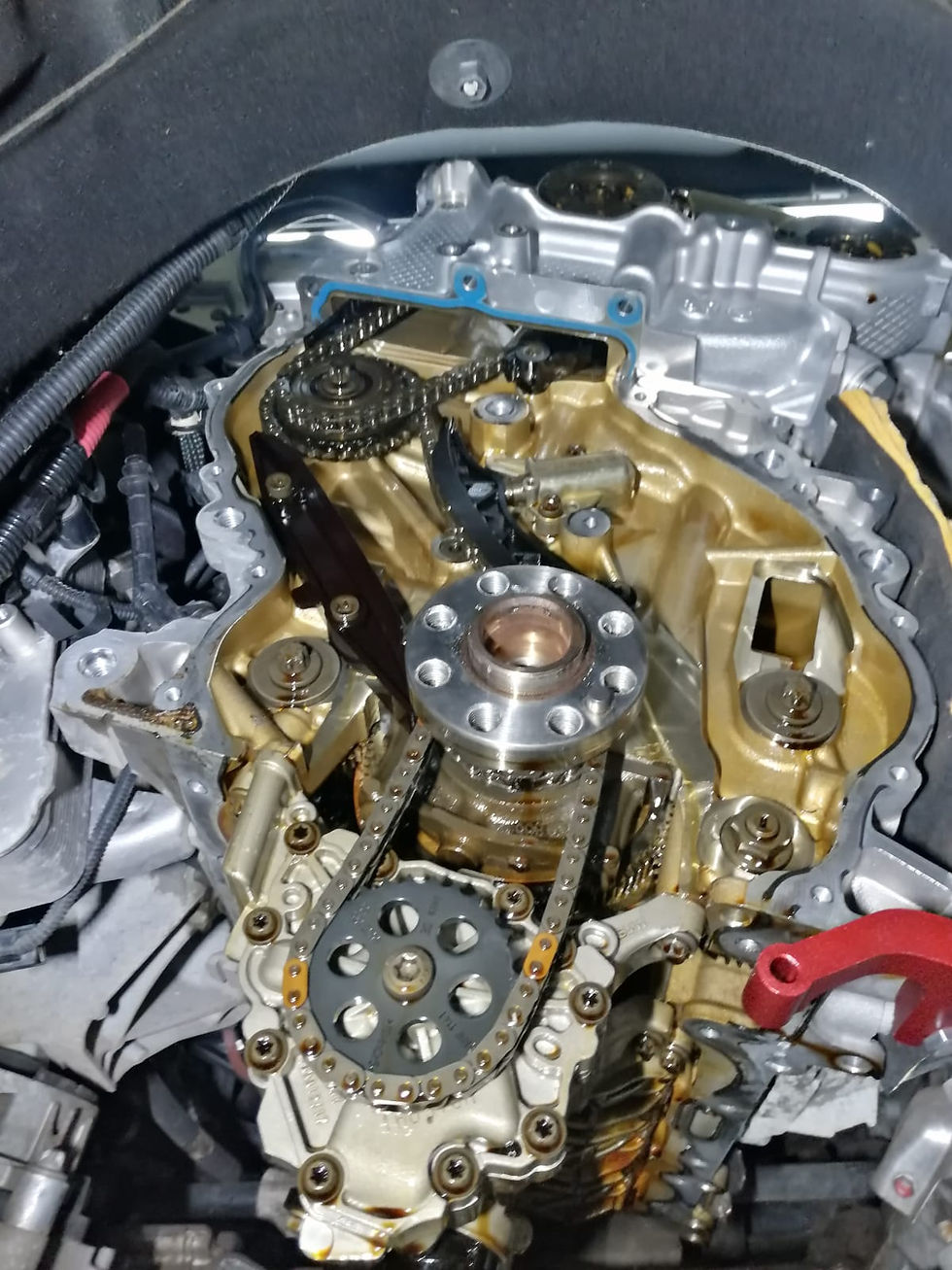 BMW timing chain exposed during professional engine diagnostics and inspection at FLEETDOC in Peterborough