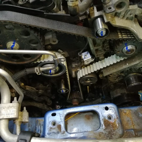 Experienced technician carrying out timing belt replacement on a vehicle in Peterborough