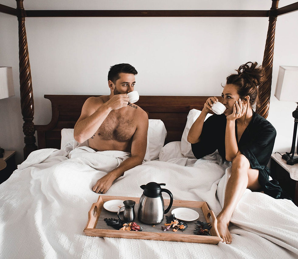 Couple enjoying coffee in bed for energy and relaxation