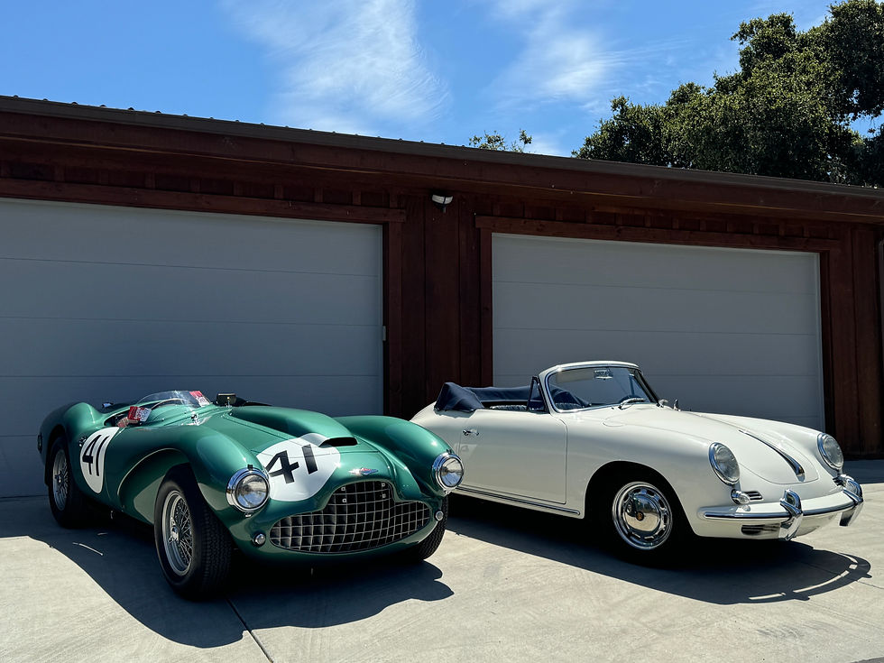 1954 Lagonda V12 and a vintage Porsche 356 in front of an oversized garage