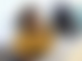 Two women sitting together, one actively listening and mentoring the other in a supportive conversation, symbolizing doula mentorship and professional growth.