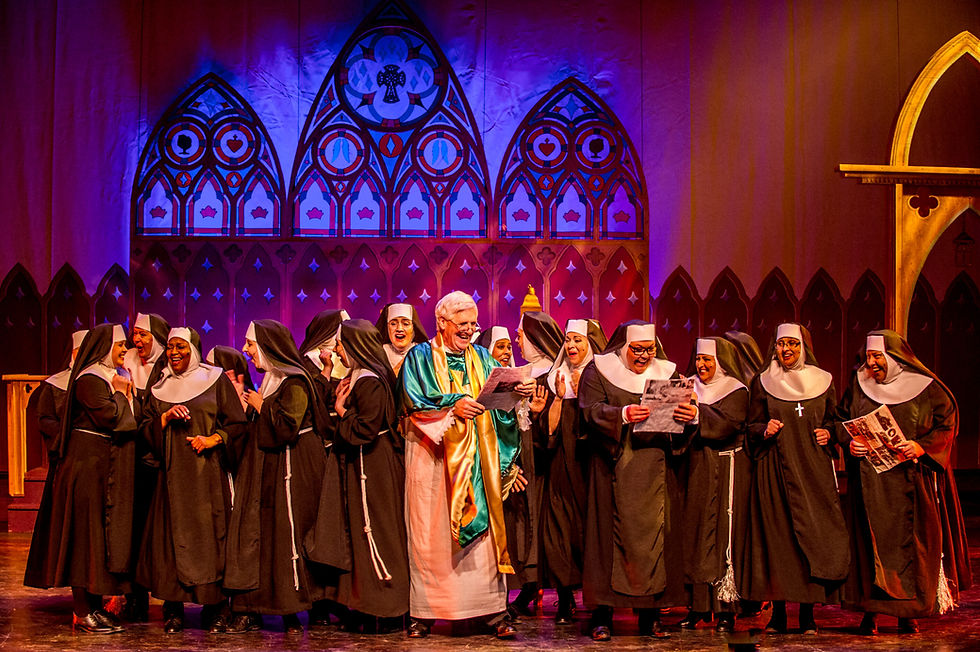 Assembled nuns of the Queen of Angels church with Monsignor O'Hara celebrating reviews in the paper