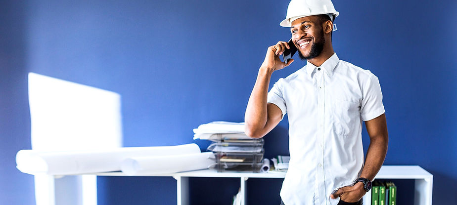 happy-african-american-engineer-talking-on-mobile-phone-in-the-office_edited.jpg
