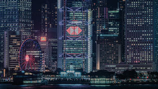 Hong Kong Immigration - City skyline at night, featuring a lit Ferris wheel and illuminated skyscrapers with logos. Reflective water foreground. Bright, vibrant mood.
