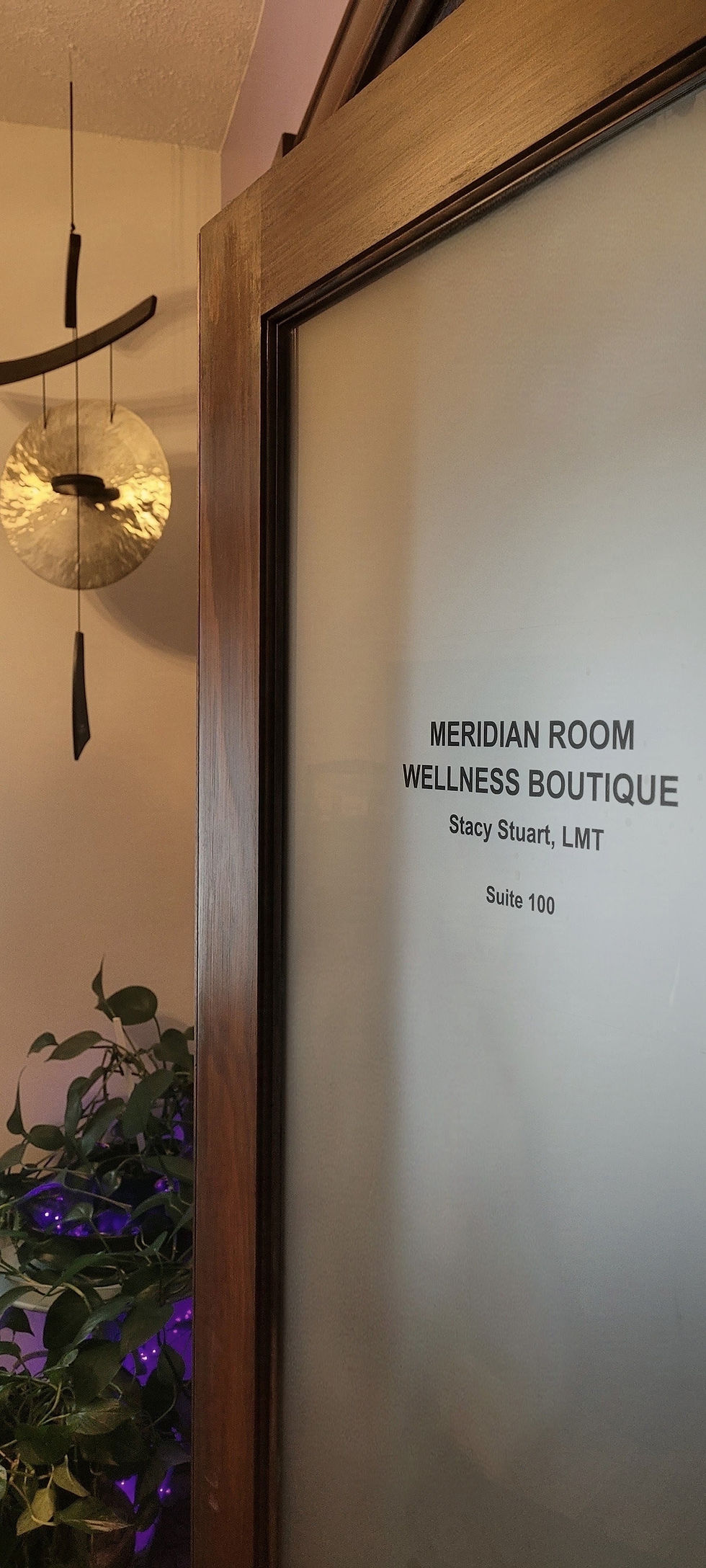 Entrance to The Meridian Room with a brass gong beside the door