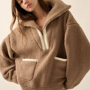 Woman wearing an oversized, ultra-soft sherpa jacket