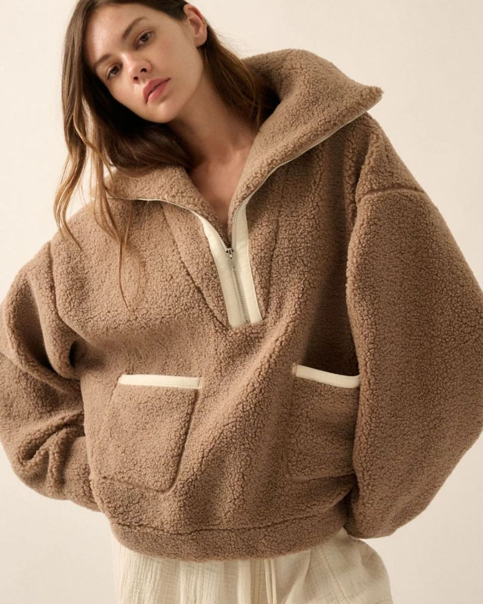 Woman wearing an oversized, ultra-soft sherpa jacket
