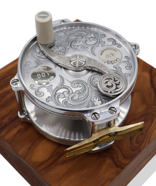 Ornate silver fly reel, hand engraving, 4/0 Salar