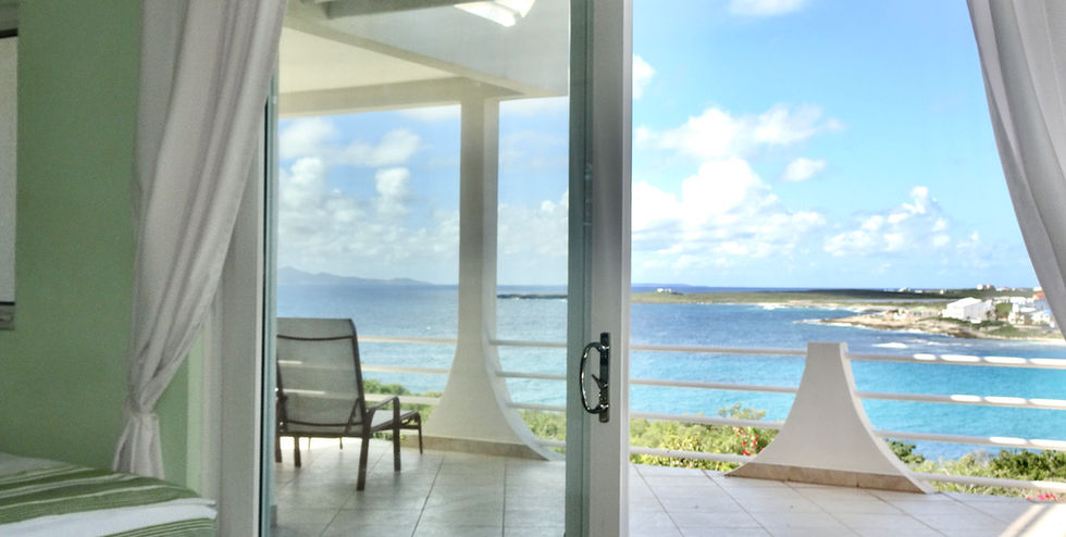 19 Bedroom 2 view of the balcony and the tip of Sandy hill beach DSC07761.jpeg