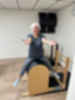 Tina demonstrating one of her favorite exercises: Horseback on the ladder barrel