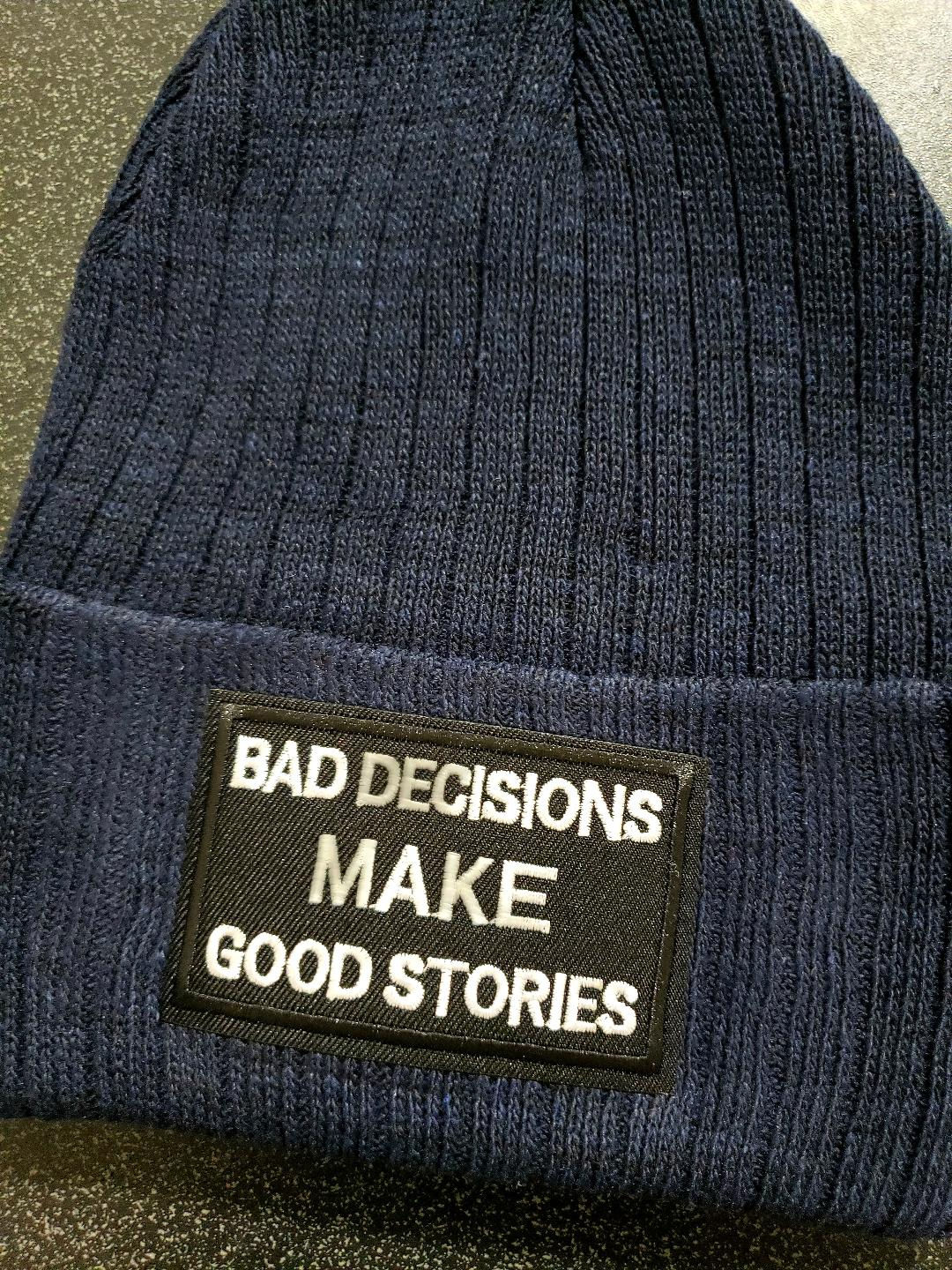 Navy beanie with 'Bad decisions make good stories' patch