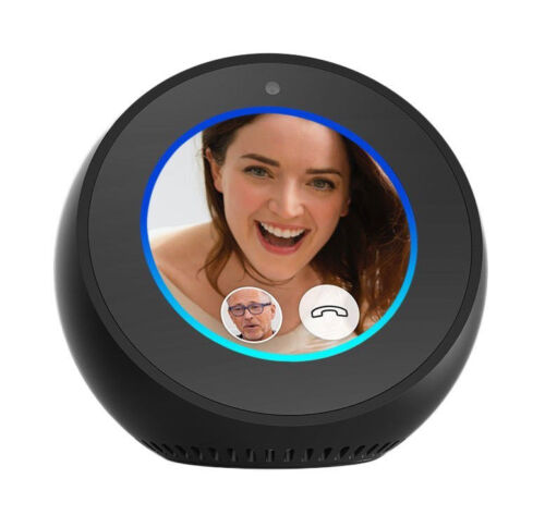 Smart speaker with screen shows a video call. A smiling woman is featured, with a small icon of a man. Background is black.
