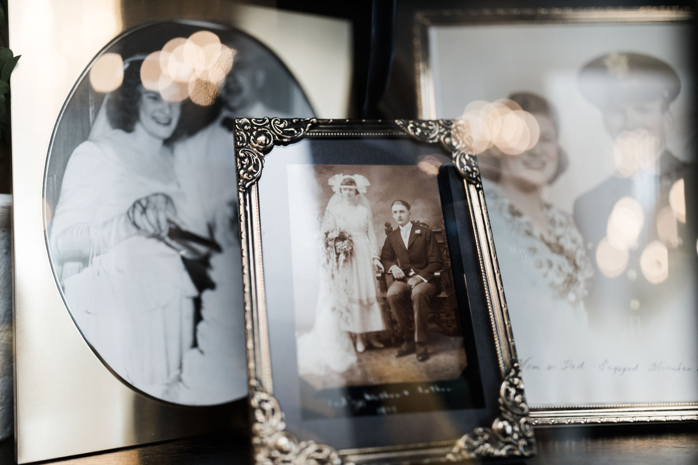 a black and white photo of a bride and groom in a silver frame